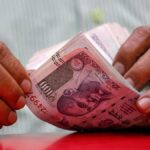 Rupee turns flat at 84.42 against U.S. dollar in early trade